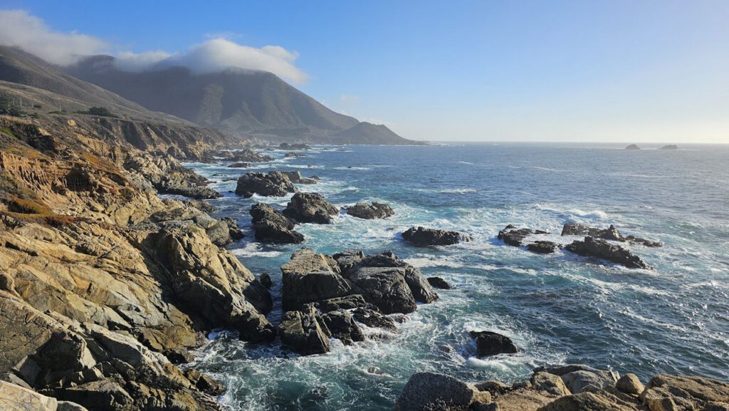 Capture the rugged beauty of Big Sur's coastline with crashing waves and scenic cliffs.